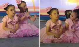 Cô bé đang múa thì ngồi phịch xuống sân khấu để ngủ, bạn đánh thức thế nào cũng không dậy