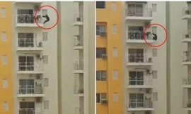 Một người Ấn Độ tập thể dục bằng cách đu bên ngoài ban-công tầng 12, ai nhìn cũng hoảng