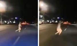 "Cái bóng trắng" lướt xuyên qua xe của người đi đường được camera ghi lại