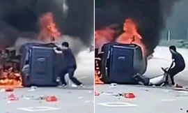 Trung Quốc: Một người dùng tay không giật bung cửa ô tô bị cháy để cứu người