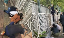 Cha mẹ ở Bắc Kinh tìm mọi cách ngó con trong ngày đầu tiên đi học, cư dân mạng đồng cảm