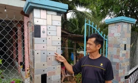 Ngôi nhà có hàng rào 'độc nhất vô nhị' được ốp hơn 2.000 vỏ điện thoại iPhone