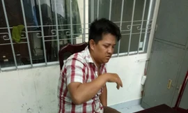 Đối tượng Lê Chính Trực tại cơ quan công an