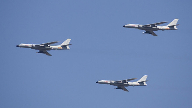 Máy bay mang tên lửa hành trình H-6K bay dàn hàng. Ảnh: AP