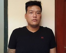 Trịnh Quang Tùng tại cơ quan công an.