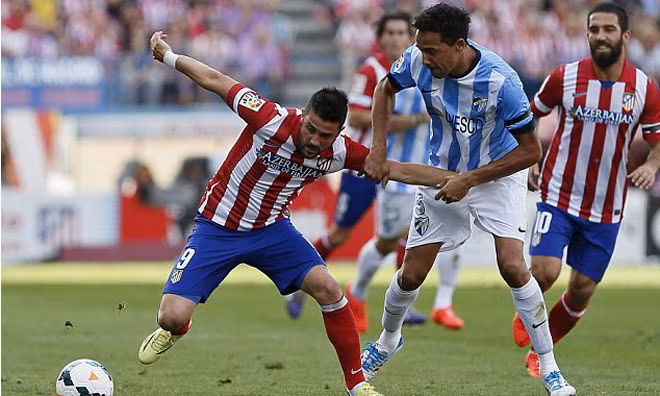 Atletico Madrid của Villa (trái) vẫn chưa thể đăng quang.
