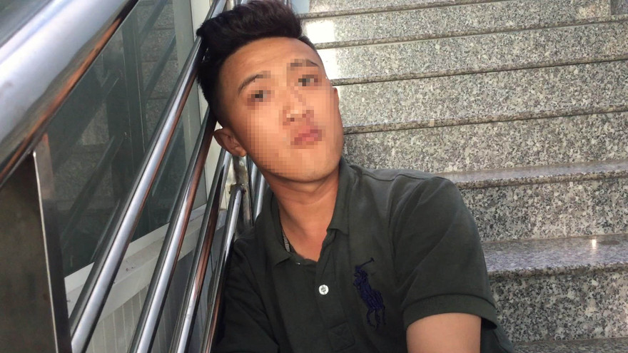 Trần Mai Xuân Thiện tại cơ quan công an.