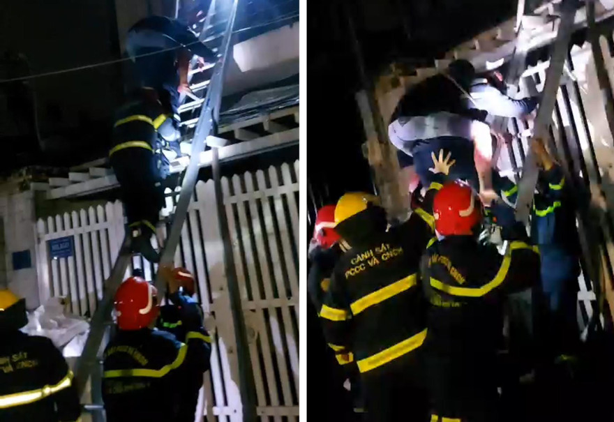 Cảnh sát cõng người đàn ông mắc kẹt trong đám cháy xuống đất.