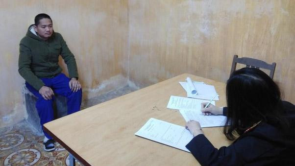 Bị can Hoàng Đức Trưởng tại cơ quan công an.