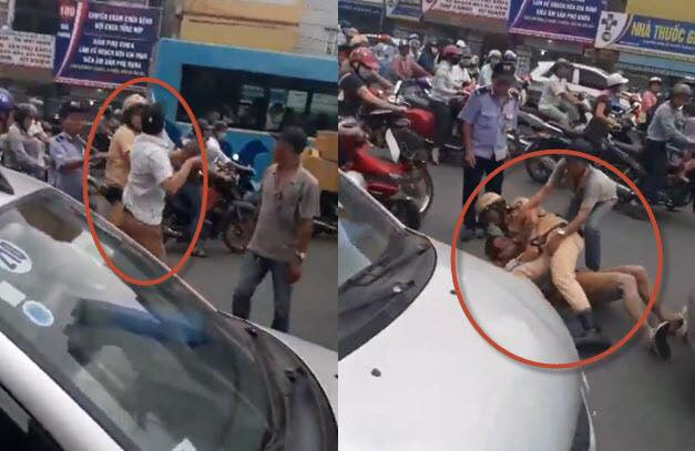 Hình ảnh CSGT quật ngã tài xế taxi trên đường Giải Phóng.