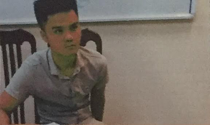 Phạm Tiến Nghĩa tại cơ quan công an.