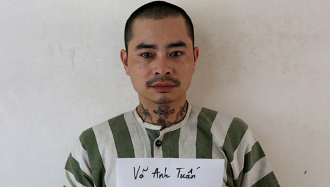 Tuấn tại cơ quan điều tra. Ảnh: N. T.