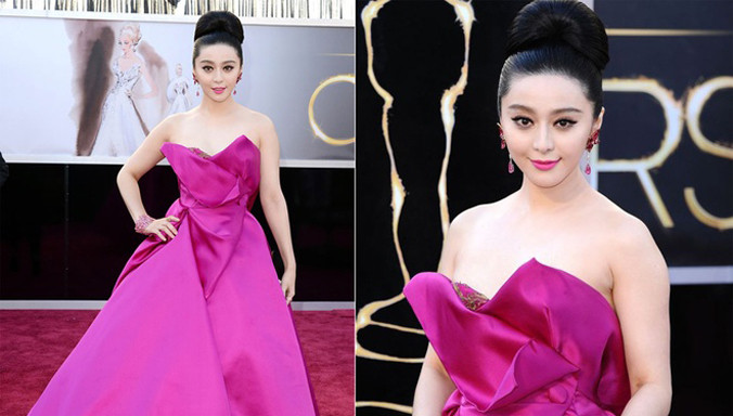 Phạm Băng Băng lần đầu dự Oscar vào năm 2013. Người đẹp diện thiết kế hồng rực của Marchesa, kết hợp bộ nữ trang cùng tông màu của thương hiệu Chopard. Ví đen là thiết kế của hãng Roger Vivier.