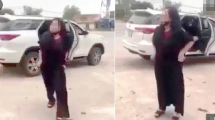 Hành động lột đồ chửi bới của bà M. trước cổng đền Cuông khiến dư luận bức xúc