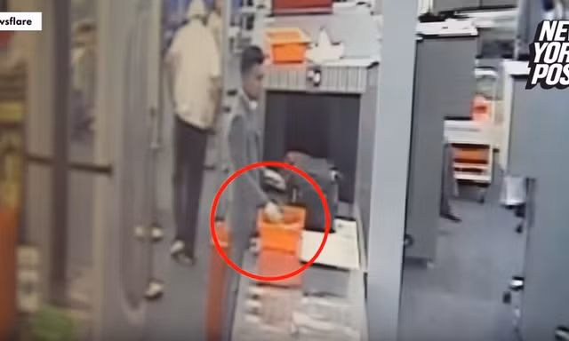 Nhân viên an ninh sân bay Thái Lan ăn cắp tiền của hành khách. Ảnh cắt từ video