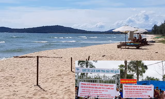 Hàng chục người dân bức xúc căng băng rôn, phản đối doanh nghiệp lập hàng rào chặn đường xuống biển Ông Lang. Ảnh: Việt Tường. 