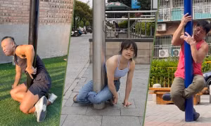 Thử thách leo cột đèn ngồi bắt chéo chân lan truyền chóng mặt ở Trung Quốc