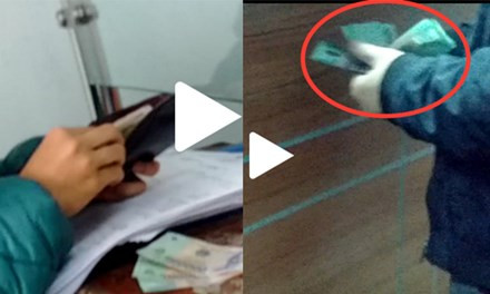 Cảnh người dân "bôi trơn" cho cán bộ hải quan. Ảnh cắt từ clip.