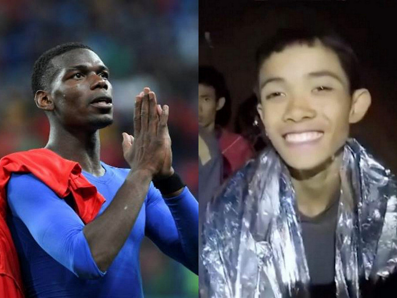 Paul Pogba (trái) và cầu thủ nhí Thái Lan (phải). 