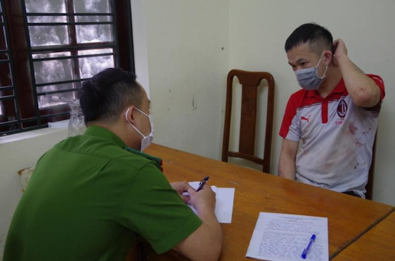 Nghi can Lành Đức Giang tại cơ quan công an.