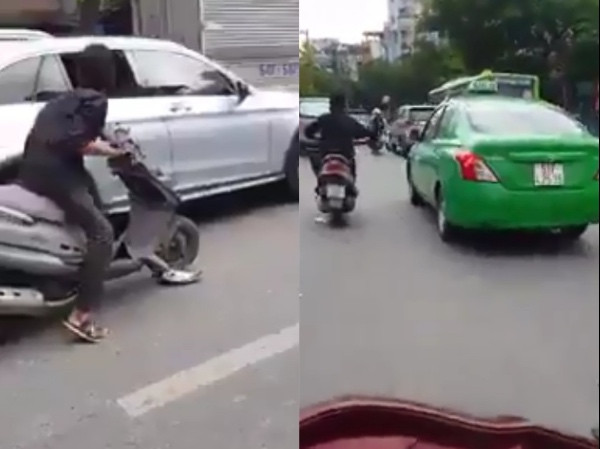 Người đàn ông cầm mã tấu chém rớt hàng loạt gương ô tô. Ảnh cắt từ clip.