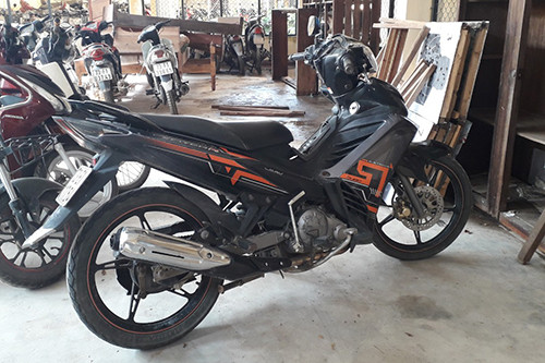Chiếc xe máy của Tình tại cơ quan điều tra. Ảnh: Công an Bố Trạch