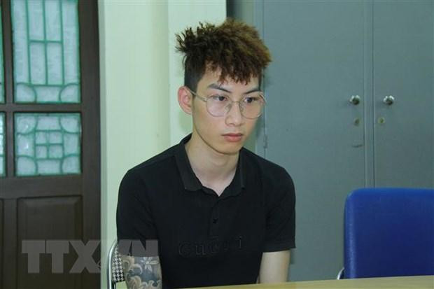 Đối tượng Vũ Minh Toàn tại cơ quan công an. (Ảnh: TTXVN)