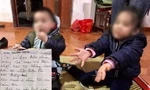 Hai cháu bé cùng bức thư tìm thấy trên người.