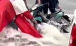 CLIP: Mưa như trút, nước chảy như thác cuốn trôi xe máy ở Bình Dương