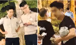 Nam thanh niên mặc áo phông đen sau khi thu tiền bán hàng rong đã mặc lại trang phục của Đội An ninh trật tự