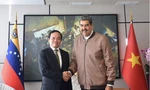 Tổng thống Venezuela Nicolás Maduro chào mừng Phó Thủ tướng Trần Lưu Quang tới thăm Venezuela. (Ảnh: VGP) 