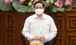 Thủ tướng Phạm Minh Chính chủ trì cuộc họp khẩn về phòng chống COVID-19. - Ảnh: VGP
