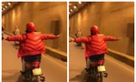 Phụ nữ lái xe máy buông cả 2 tay khiến người đi đường khiếp sợ