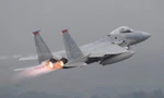 Tiêm kích F-15 Mỹ cất cánh từ đảo Okinawa (Nhật Bản). Ảnh: Reuters