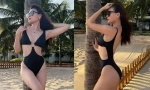 Thúy Diễm khoe dáng nóng bỏng với áo tắm cắt xẻ
