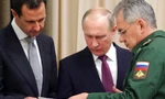 Tổng thống Syria Bashar al-Assad (trái), Tổng thống Nga Vladimir Putin (giữa) và Bộ trưởng Quốc phòng Nga Sergei Shoigu xem xét tài liệu trong cuộc gặp tại thành phố Sochi của Nga hồi cuối tháng 11/2017. Ảnh: Kremlin.ru.