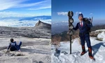 Người đàn ông Nhật Bản mặc suit đi leo núi đến trượt tuyết, không thiếu chỗ nào!