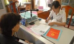 TPHCM giao chi nhánh Văn phòng đăng ký đất đai các quận huyện cấp sổ đỏ cho người dân.