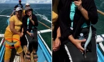 Ngàn năm có một: Cá nhảy lên “giật” điện thoại của du khách trên thuyền