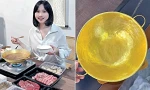 Cô gái ăn lẩu trong chiếc nồi bằng vàng nặng 1 kg, thức ăn có ngon hơn không?