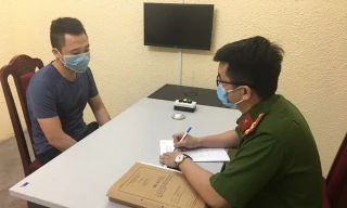 Bị can Nguyễn Thăng Long tại cơ quan công an (Ảnh: CTV).