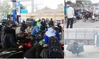 Người dân xếp hàng dài, mang thêm bình nhựa mua xăng trước giờ tăng giá