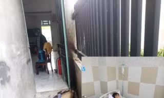 Một phụ nữ bị đánh nhập viện, nhà bị tưới xăng đốt