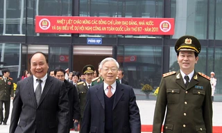 Tổng Bí thư Nguyễn Phú Trọng, Phó Thủ tướng Nguyễn Xuân Phúc và Bộ trưởng Công an Trần Đại Quang đến dự hội nghị. Ảnh: TTXVN