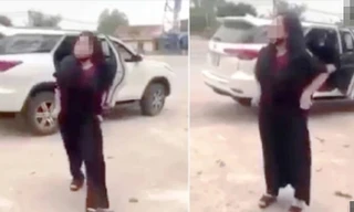 Hành động lột đồ chửi bới của bà M. trước cổng đền Cuông khiến dư luận bức xúc