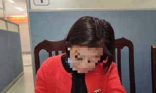 Người phụ nữ bị triệu tập tới cơ quan công an. Ảnh: Công an TP Hà Nội