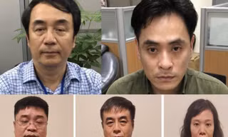 Ông Trần Hùng cùng một số bị can trong vụ án sách lậu.