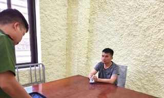 Hà Văn Tỵ tại cơ quan công an. Ảnh: TL