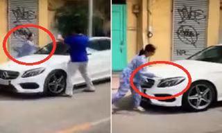 Bị thách thức,người phụ nữ cầm dao, búa đập phá xe đỗ trước cửa nhà