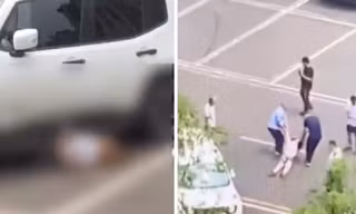 Chiếc xe trắng nhiều lần cán lên người nạn nhân ở bãi đỗ. (Ảnh từ clip)